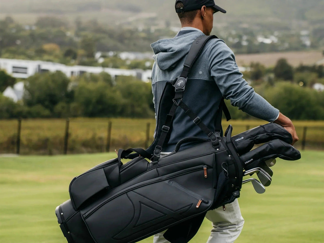 Golfer carrying a stand bag on the course deciding when to use a fairway wood