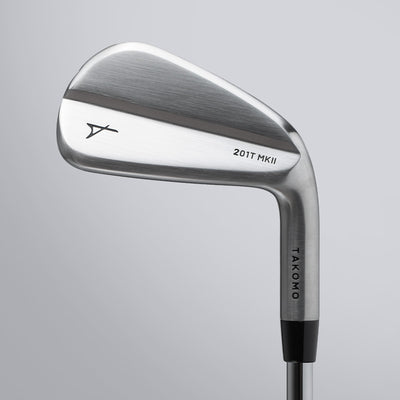 Golf club head with 'Takomo' branding on a gray background