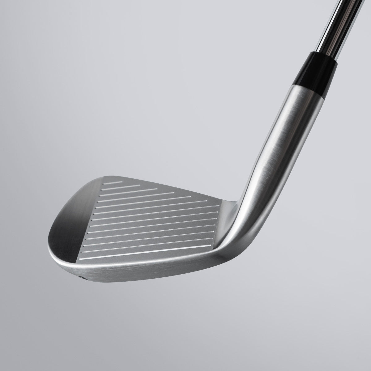 Close-up of a golf club on a light gray background
