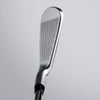 Close-up of a golf club head on a light gray background