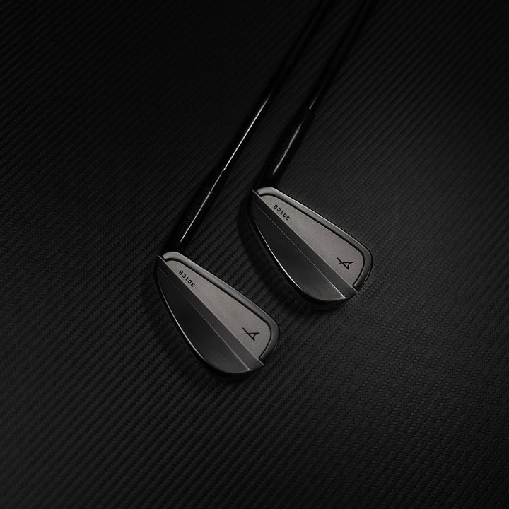 Two golf clubs on a textured black background
