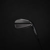Golf club head on a black background