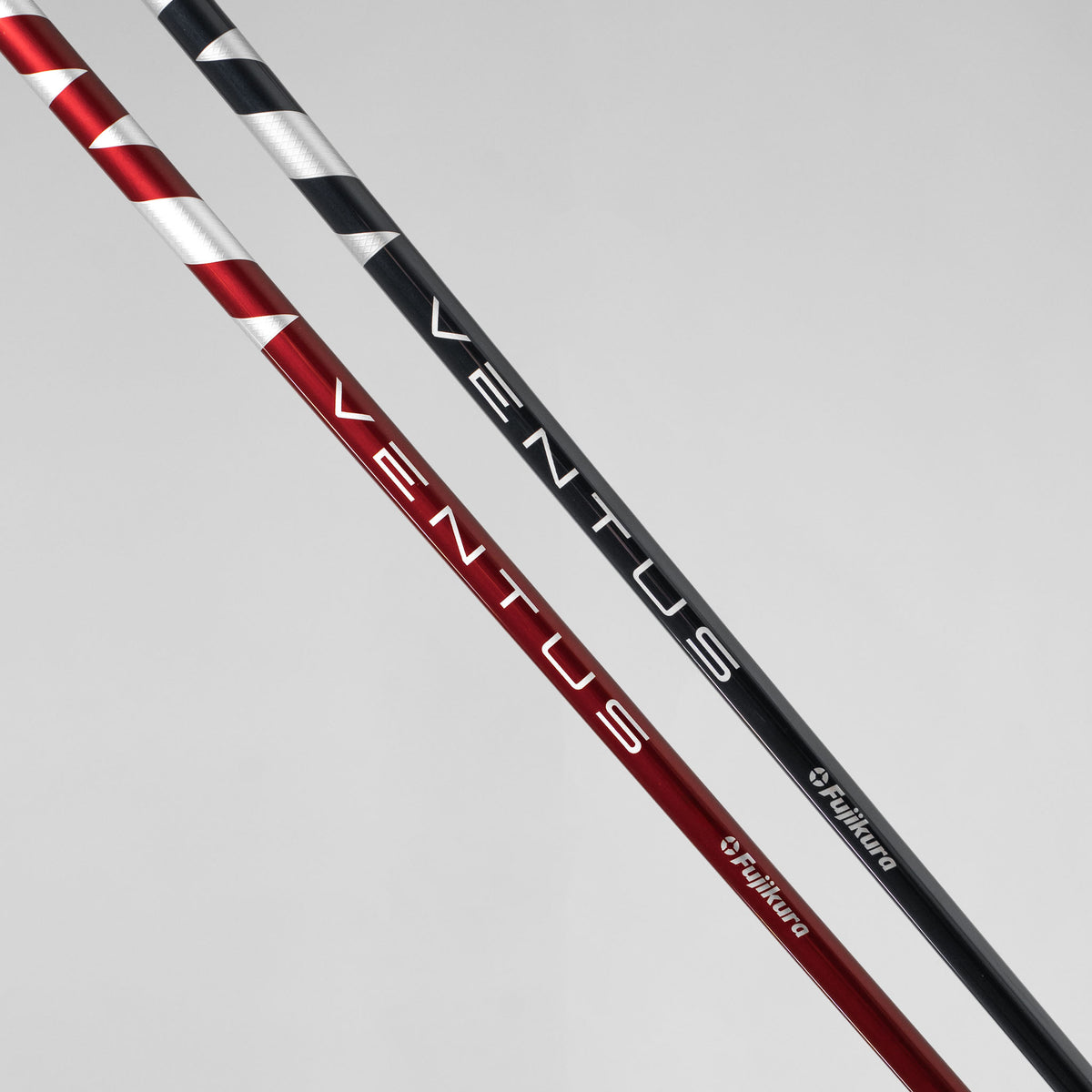 Fujikura Ventus Blue and Red golf shafts for a Takomo IGNIS D2 driver, photographed against a light gray background.