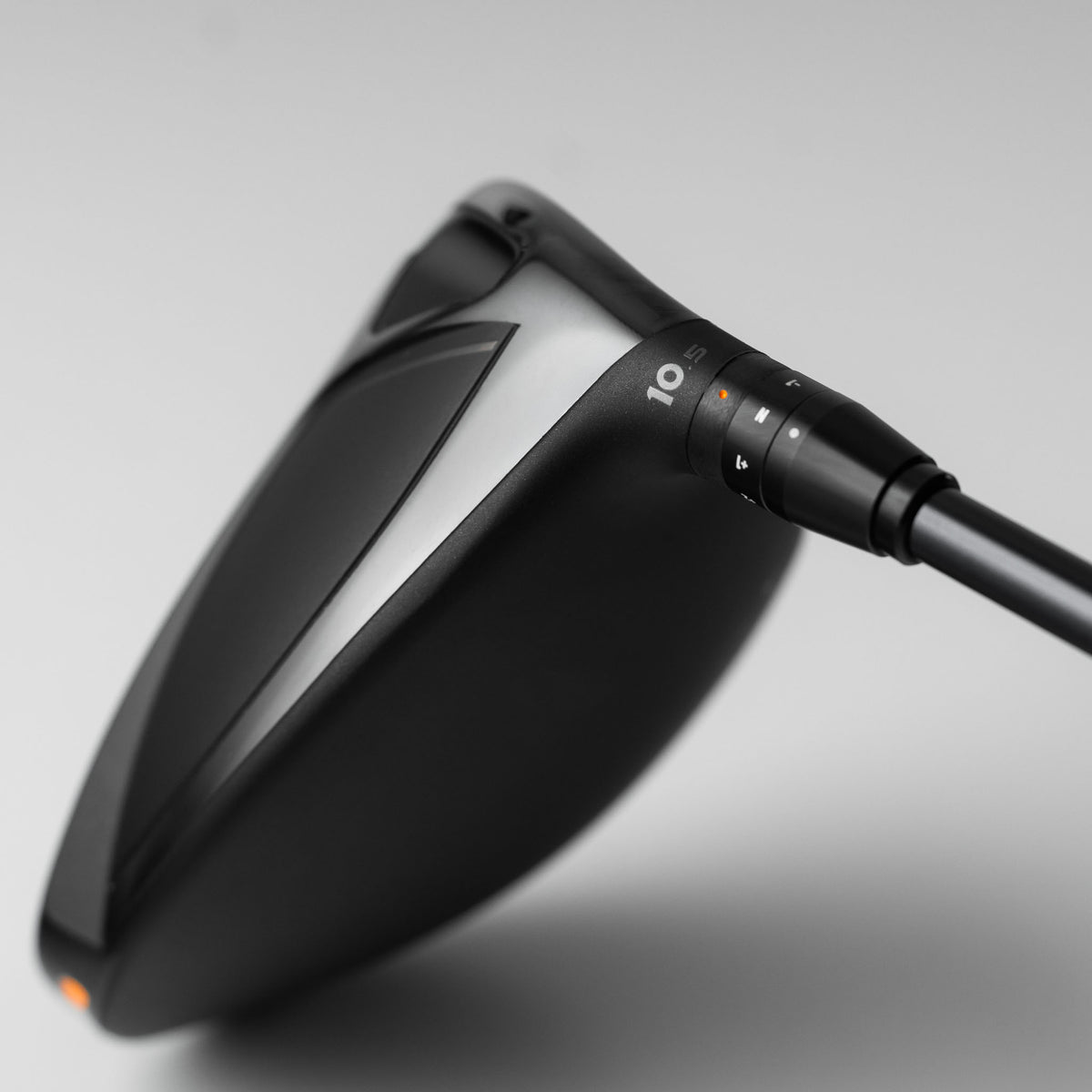Close-up of a Takomo IGNIS D2 golf driver club head with the adjustable adapter sleeve in focus.