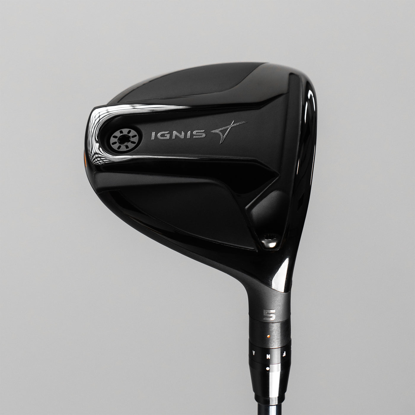 Black golf club head with 'IGNIS' branding on a gray background