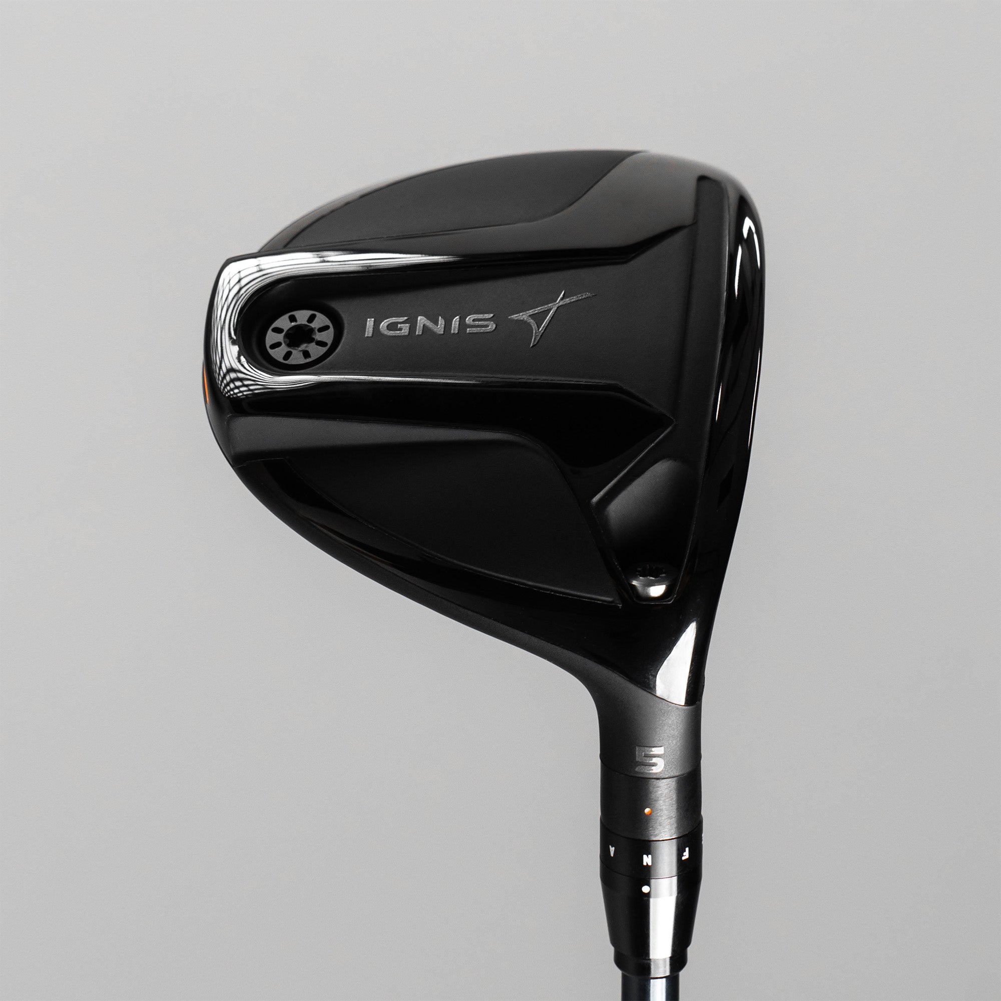 Black golf club head with 'IGNIS' branding on a gray background