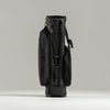 Black golf bag on a light gray background