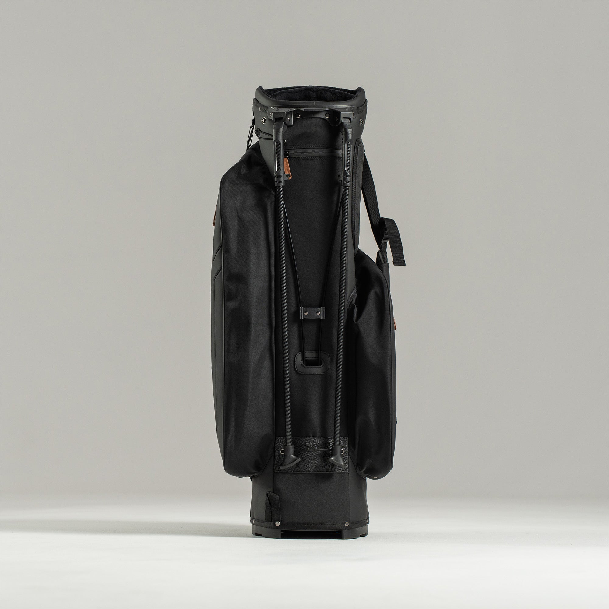 Black golf bag on a light gray background