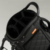 Black golf bag with a gray background