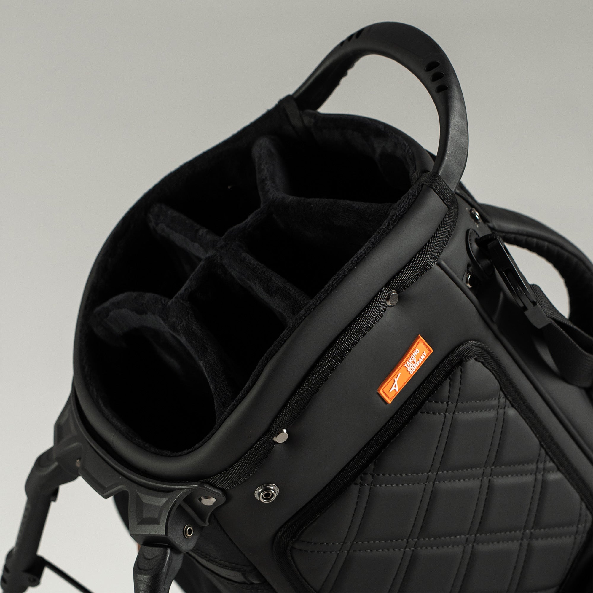 Black golf bag with a gray background