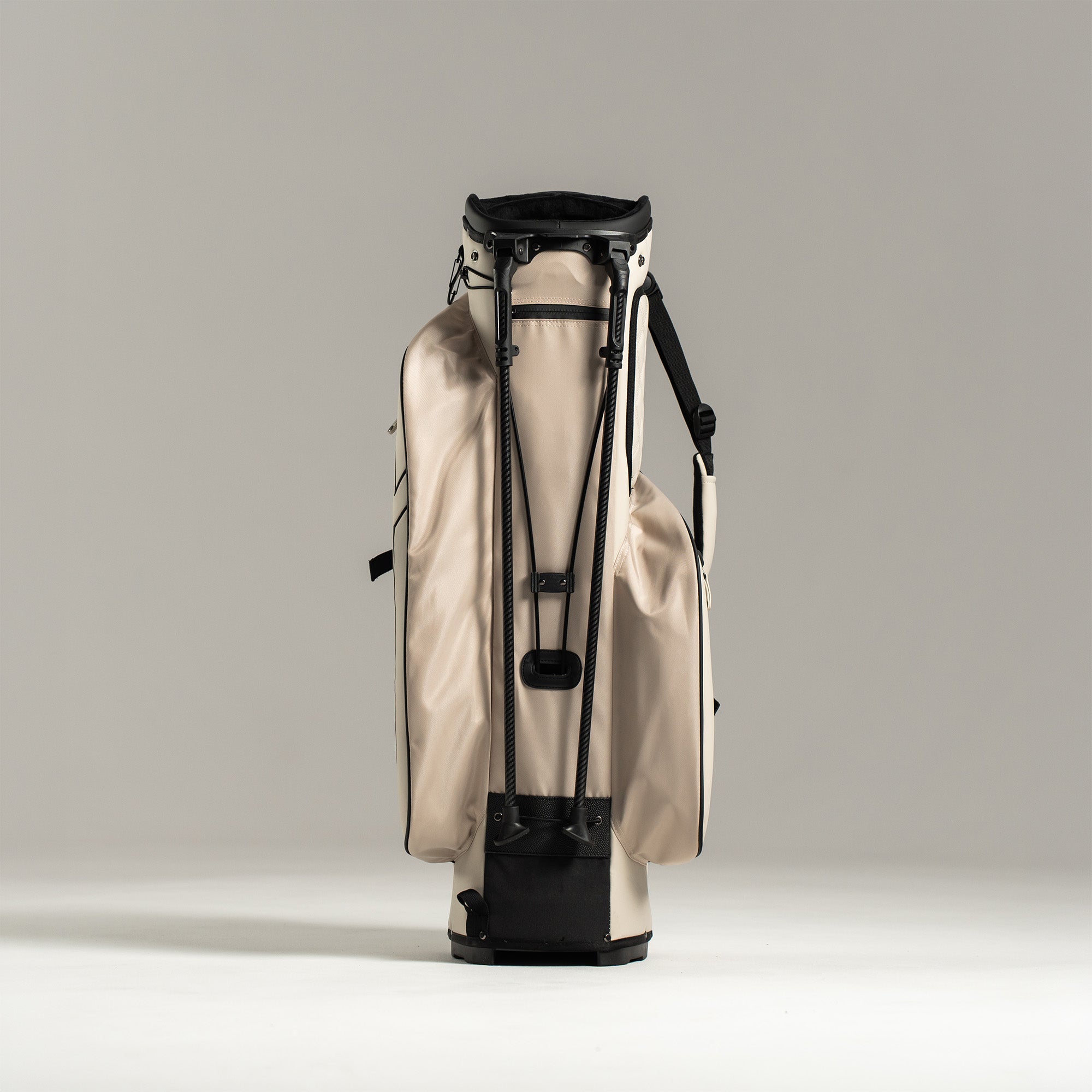 White golf bag with black accents on a light gray background