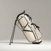 White golf bag with black accents on a gray background
