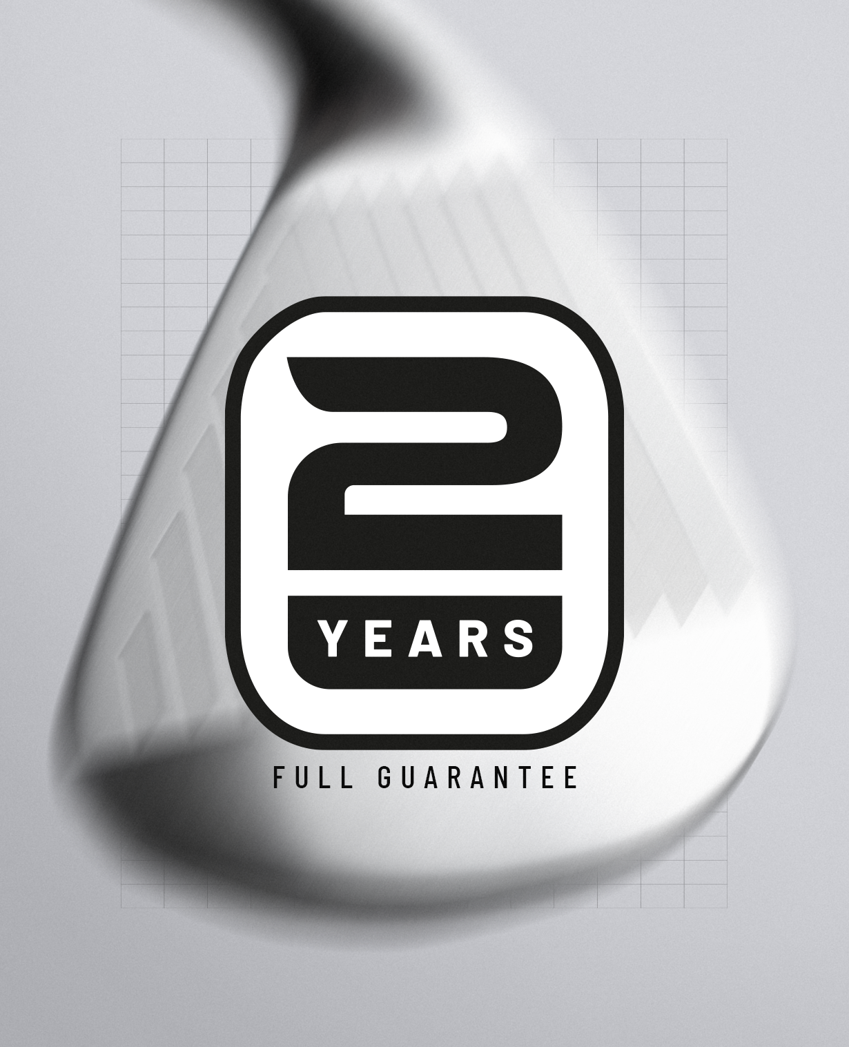 A close-up of a metallic golf club head with a large black and white '2 YEARS FULL GUARANTEE' badge overlaid in the center, on a light gray background with a faint grid pattern.