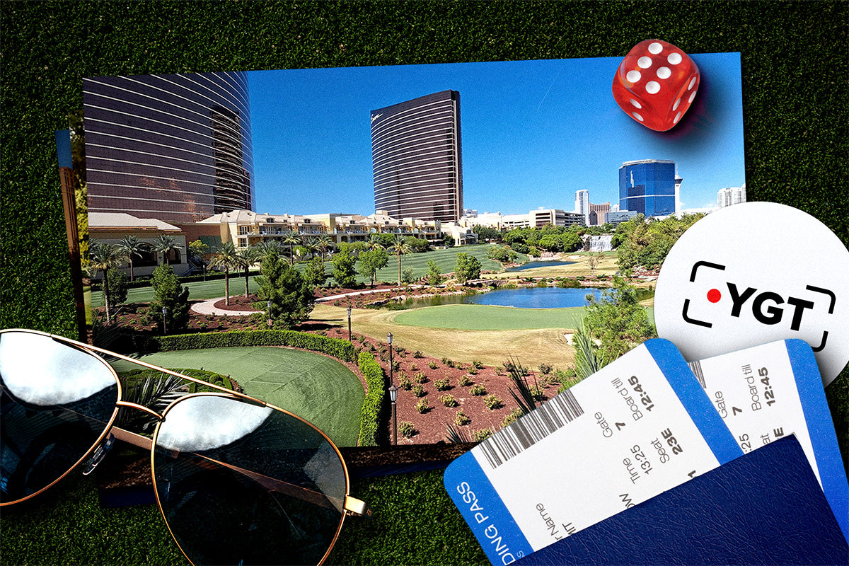 Golf course with buildings, sunglasses, and YGT branded items on grass